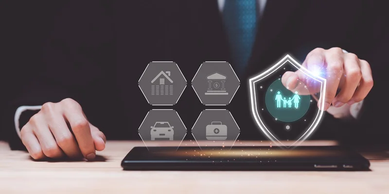 Hand selecting a digital shield icon above a tablet