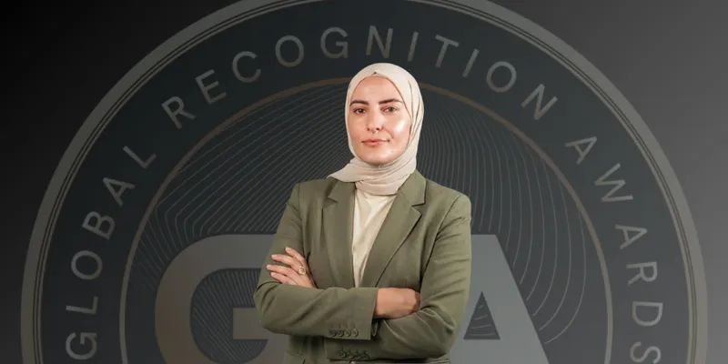 Selma Kadiric in front of the Global Recognition Awards logo